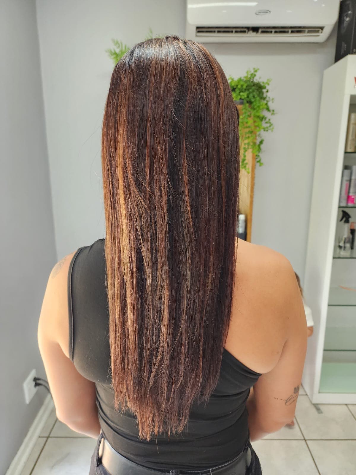 Glossy brunette hair finished at Olivia Hair & Beauty Salon